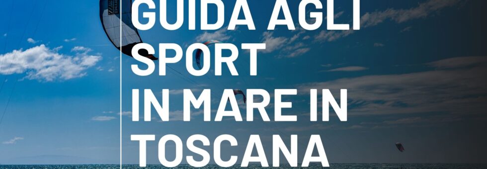 Kitesurf in azione in mare aperto in Toscana con vele colorate e cielo azzurro, ideale per sport di vento.
